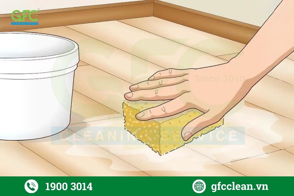 Sử dụng miếng bọt biển rửa chén hoặc cây lau nhà để làm sạch vết dầu mỡ